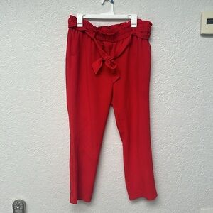 Size Large red polyester dress pants from LOFT. Lightly worn only a few times.